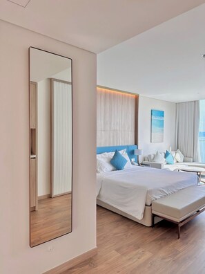 Departamento Deluxe, balcón, vista a la playa | Área de sala de estar