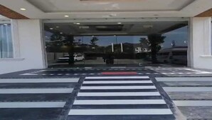 A building entrance with a crosswalk leading inside. - Hotel Town Star (Srinagar)