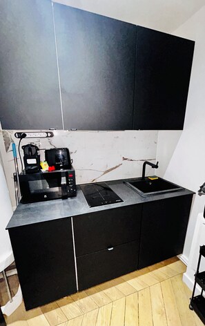 Microwave, stovetop, coffee/tea maker, cookware/dishes/utensils