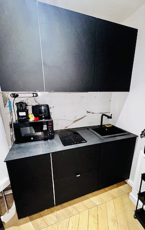 Microwave, stovetop, coffee/tea maker, cookware/dishes/utensils