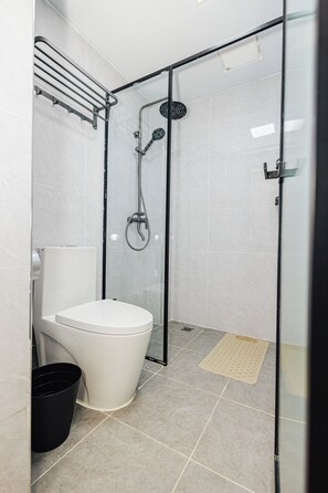 Shower, towels, soap, toilet paper