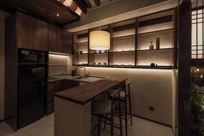 Fridge, coffee/tea maker, cookware/dishes/utensils