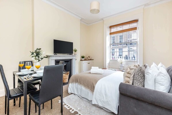 1 bedroom, desk, iron/ironing board, travel crib