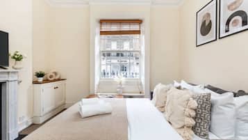 1 bedroom, desk, iron/ironing board, travel crib