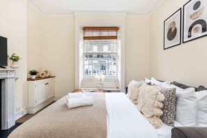 1 bedroom, desk, iron/ironing board, travel crib