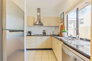 Coffee/tea maker, fridge, microwave, oven