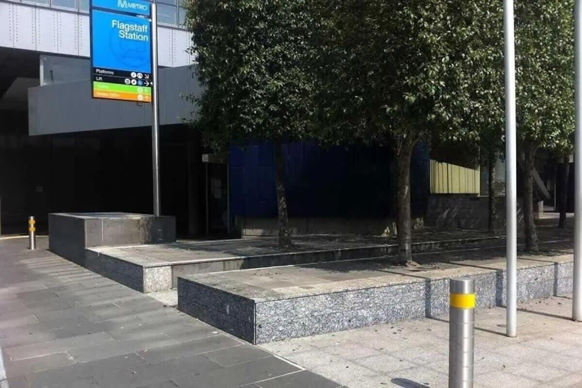 A modern building with a blue sign indicating a metro station.