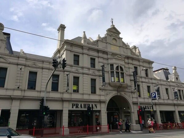 A historic building with an arched entrance labeled "PRAHRAN MARKET."