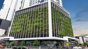 A modern building with a vertical garden facade, a prominent entrance labeled "45 CLABKE STREET," and a visible "PLATINUM" sign. - A Cozy 2BR Apt With Panoramic Views, Free Parking (Melbourne)