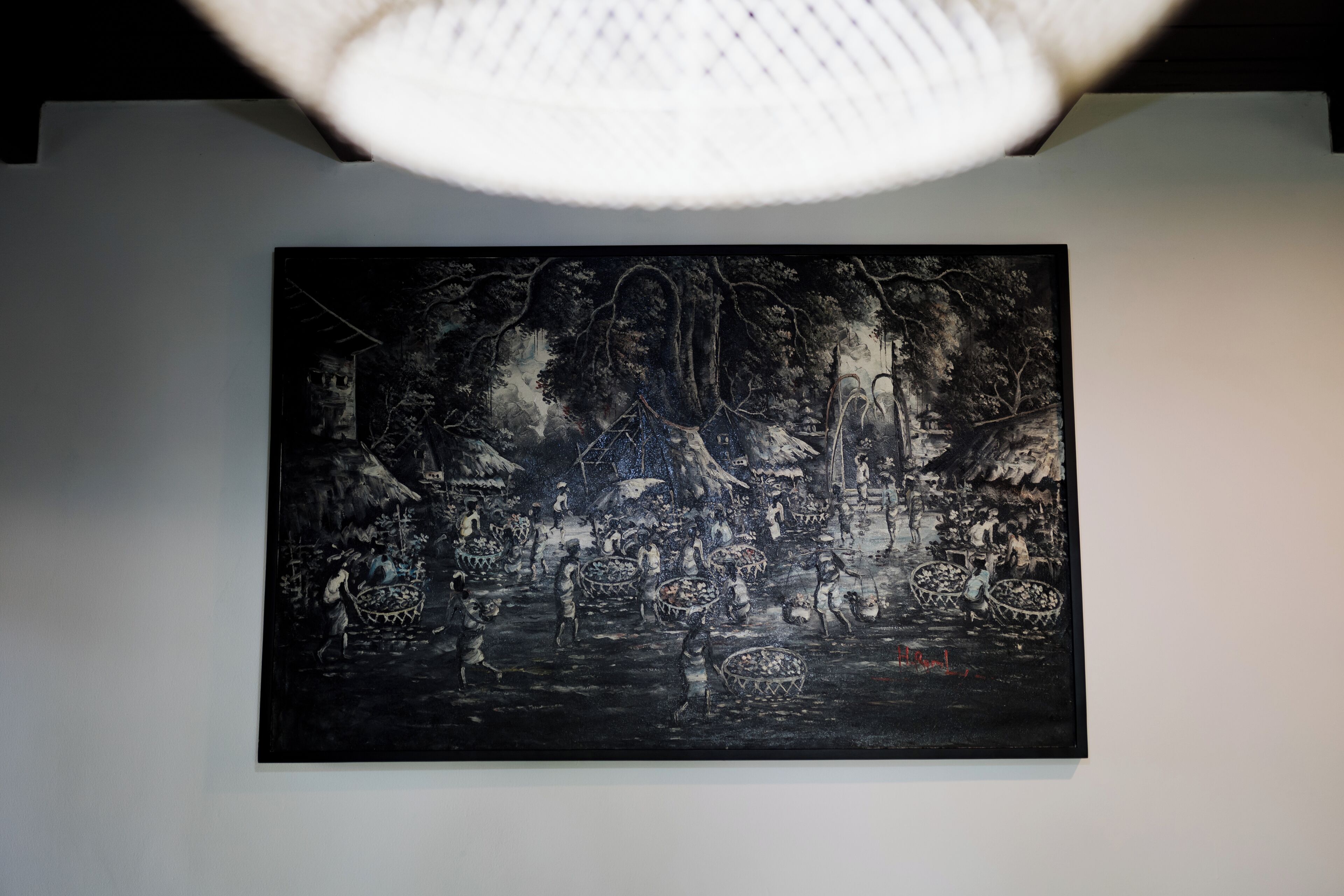 A black and white painting of a bustling market scene with people and boats.