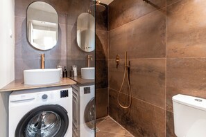 Shower, hair dryer, towels, soap