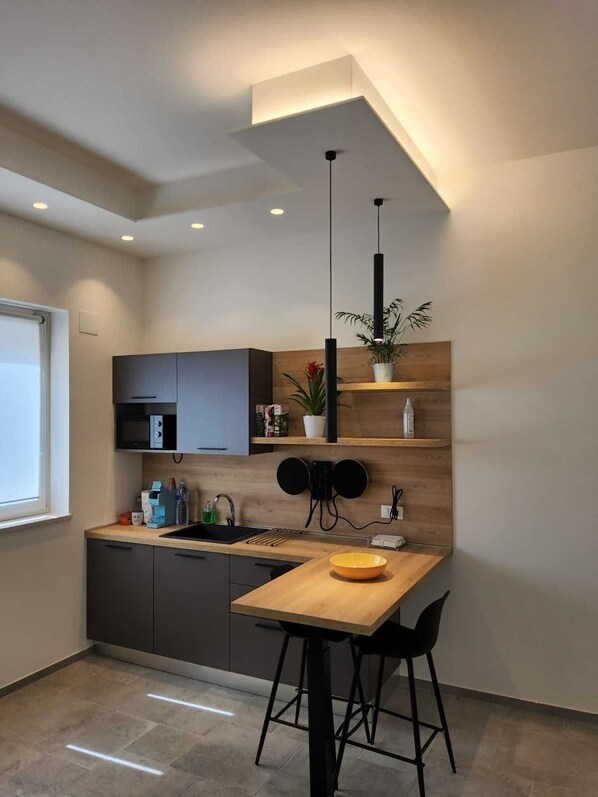 Fridge, microwave, coffee/tea maker, toaster