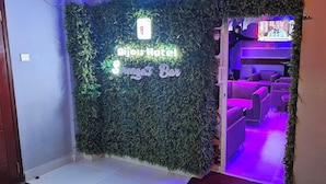 A hotel entrance with a sign for Bijou Hotel and Serenity Bar. - Bijou Hotel Mlolongo (Mlolongo)