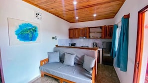 Appartement Confort, vue piscine | Coin séjour