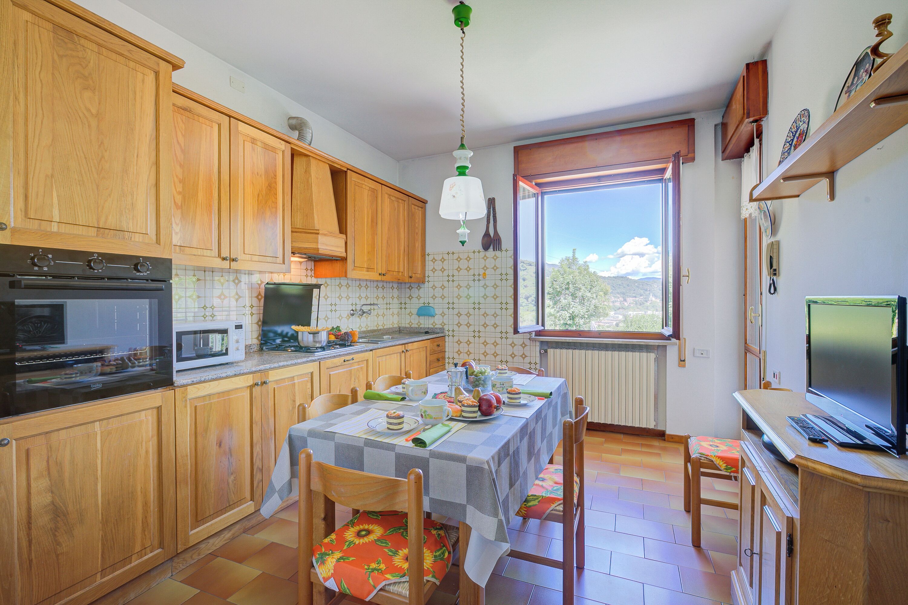 Family Apartment, Multiple Bedrooms (A Due Passi Dal Bosco) | Private kitchen | Fridge, microwave, oven, stovetop