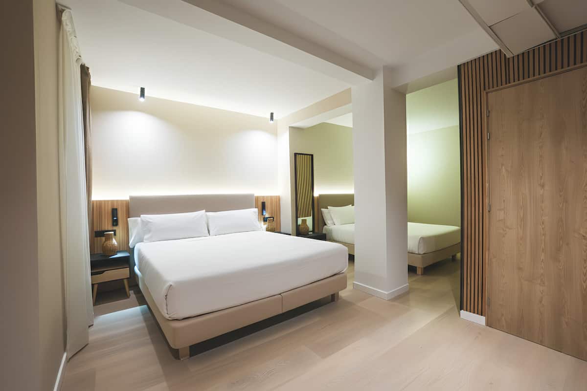 Standard Triple Room, Non Smoking | Living area | 55-inch TV with cable channels