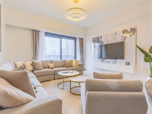 Luxury Apartment, Balcony, City View | Living area | 55-inch Smart TV with digital channels