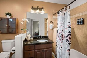 Shower, hair dryer, towels, shampoo