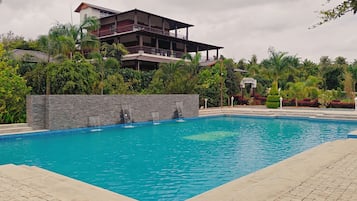 Outdoor pool, pool umbrellas, pool loungers