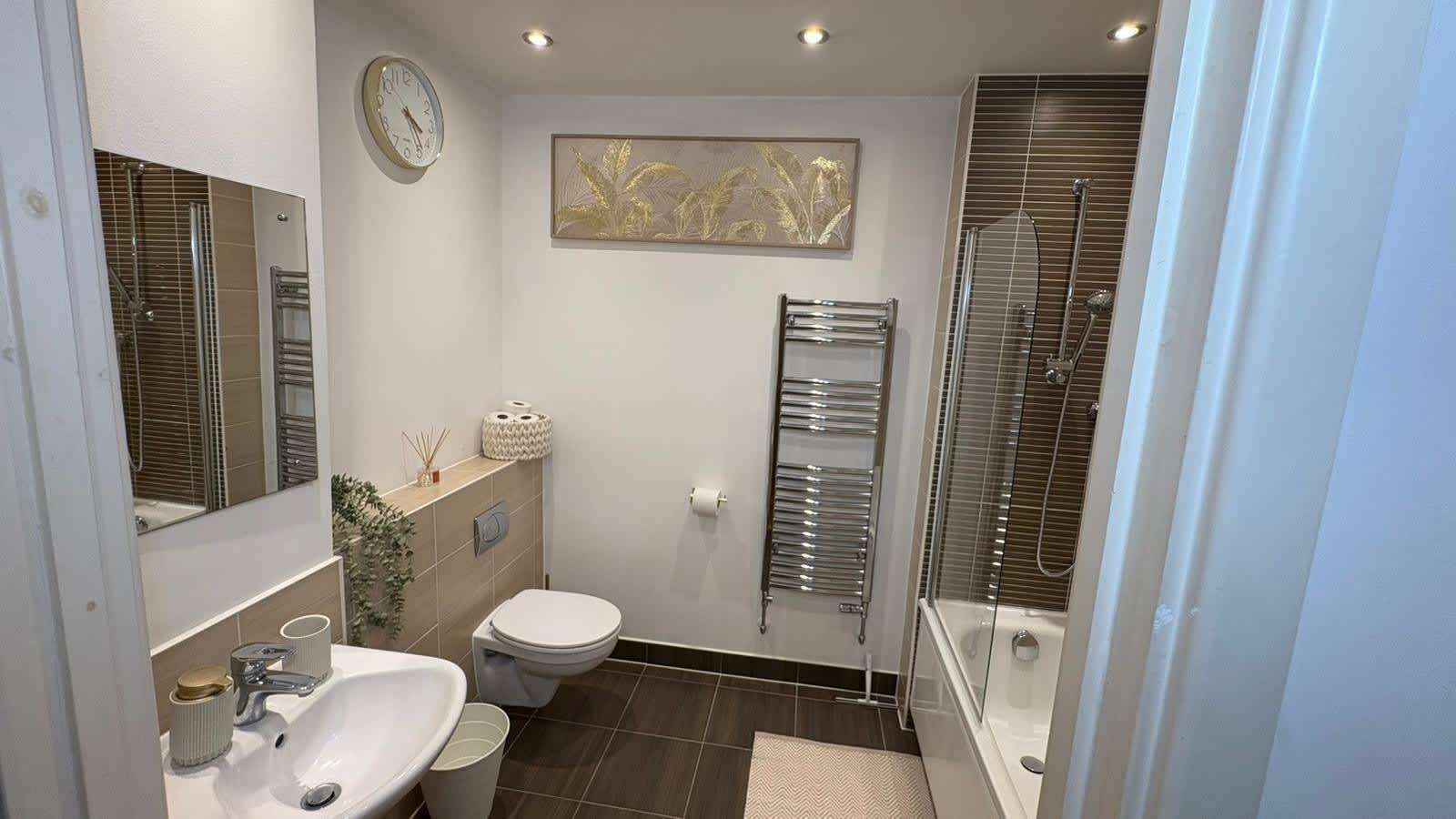 Shower, hair dryer, towels, shampoo