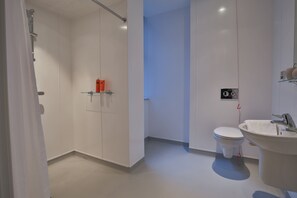 A modern bathroom with a toilet, sink, and shower. - Student Only Oldgate House (Huddersfield)