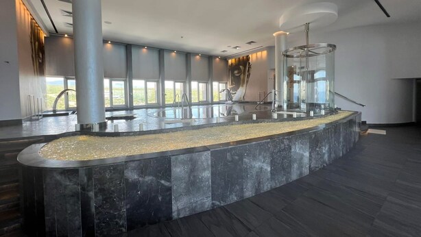 A spacious indoor area with a central water feature, large windows, and a modern architectural design. - Studio suite in Luxurious resort with scenic view in amazing Cabo San Lucas  (Cabo San Lucas)