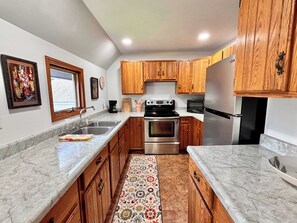 Fridge, microwave, stovetop, coffee/tea maker