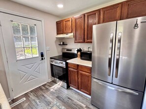 Fridge, microwave, stovetop, coffee/tea maker