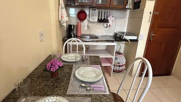 Family Studio, Multiple Beds | Private kitchen | Full-sized fridge, microwave, coffee/tea maker, cookware/dishes/utensils