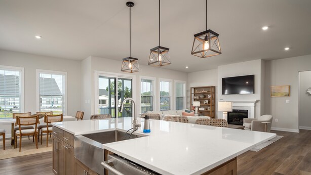 A spacious kitchen with a large island, wooden cabinets, and pendant lighting. - 15325 West Kea Way, Tower Hill: 4  BR, 3.5  BA House in Lewes, Sleeps 8 (Lewes)