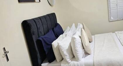 2-bedroom cozy apartment in a prime location in Lusaka with AC, fitness room