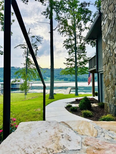 Escape to our beautifully updated lakeside retreat, where every detail is designed for comfort and relaxation. From the moment you step inside this 3 bed/2bath house, you'll be captivated by sweeping, unobstructed views of the lake through expansive