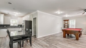 A spacious living area with a pool table, dining table, and kitchen. - 11 Mi to Fort Lee: 5-acre Retreat w/ Scenic Views (Petersburg)