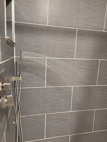 Towels, soap, toilet paper. Modern Studio SmartTV, Coffee Bar & Rainfall Shower