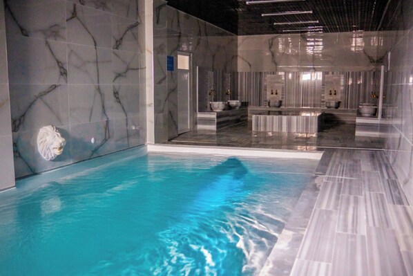 Indoor pool, seasonal outdoor pool, pool umbrellas, pool loungers