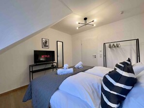 4 bedrooms, desk, iron/ironing board, travel cot