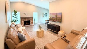 TV, fireplace, books