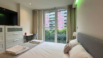 1 bedroom, desk, iron/ironing board, travel cot