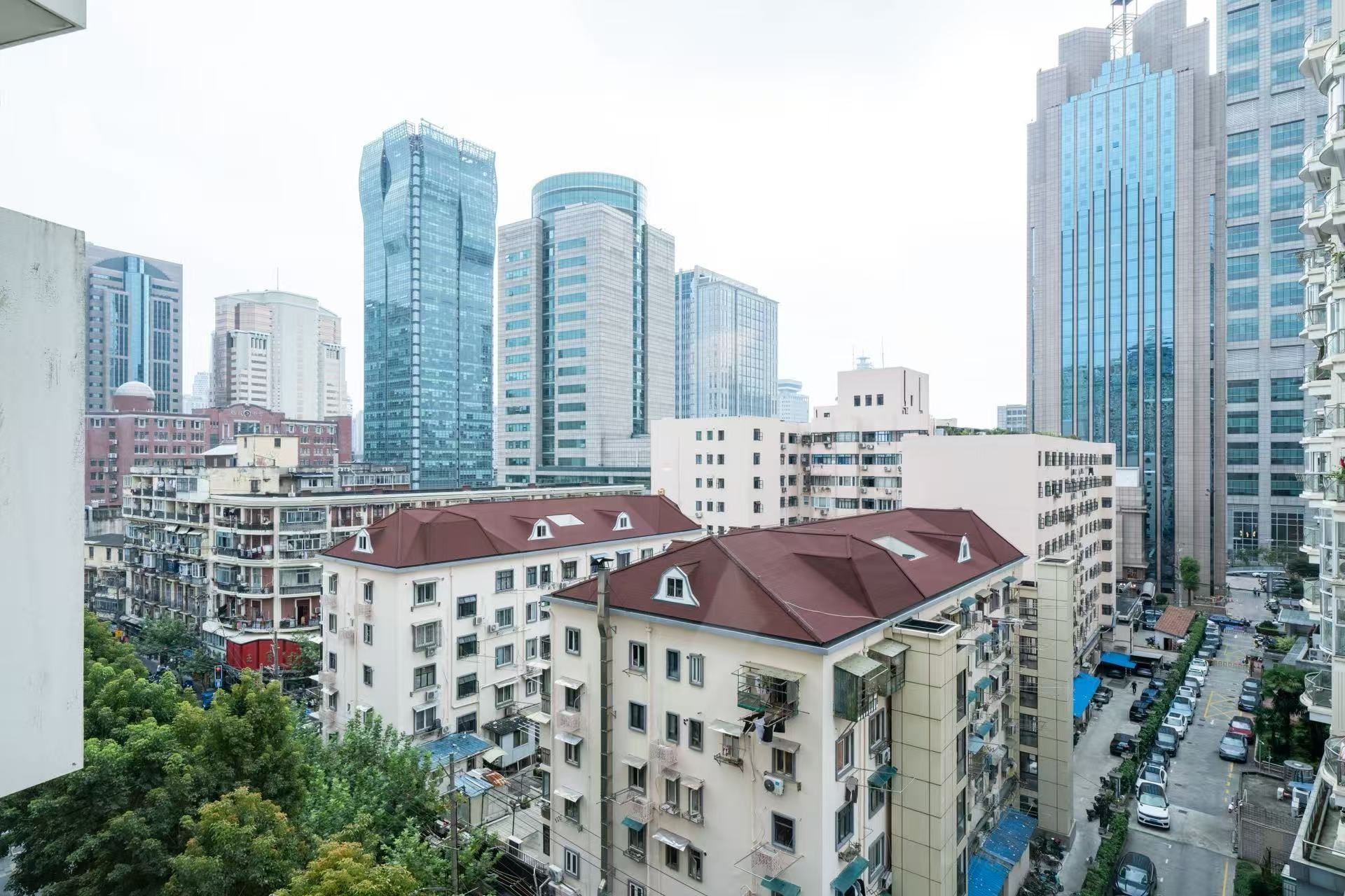 A high-rise building with multiple floors, large windows, and a modern architectural design.