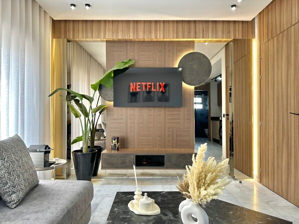 Deluxe studio suite, uitzicht op de stad | Woonruimte