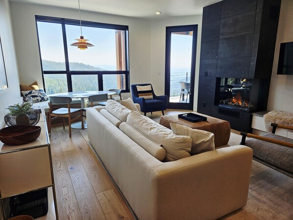 TV, fireplace, books - NEW! Five Needles 214 2BR Lake Pend Oreille View Condo (Sandpoint)