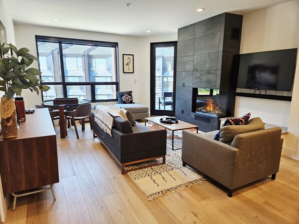 TV, fireplace, books - NEW! Five Needles 317 - 2BR w/ Balcony & Fireplace (Sandpoint)