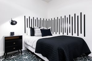 1 bedroom, desk, iron/ironing board, travel crib