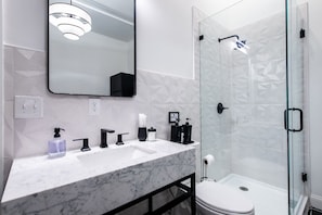 Shower, eco-friendly toiletries, hair dryer, towels