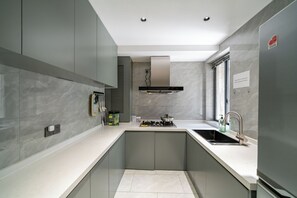 Senior Apartment | Private kitchen | Fridge, cookware/dishes/utensils, paper towels - Book and Bed - SML Center (Shanghai)