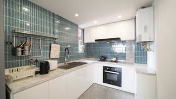 Senior Apartment | Private kitchen | Cookware/dishes/utensils, cleaning supplies, paper towels