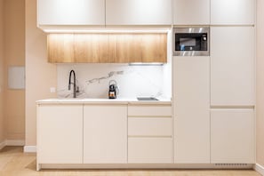 Fridge, microwave, stovetop, coffee/tea maker