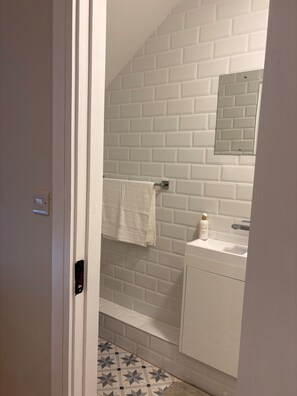 Shower, towels, soap, toilet paper