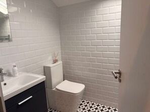 Shower, towels, soap, toilet paper