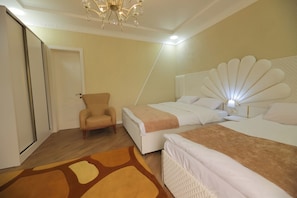 Family Suite, Balcony, Pool View | Desk, laptop workspace, soundproofing, iron/ironing board